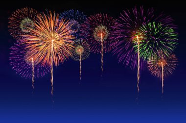 Colorful fireworks celebration and the twilight sky background. clipart