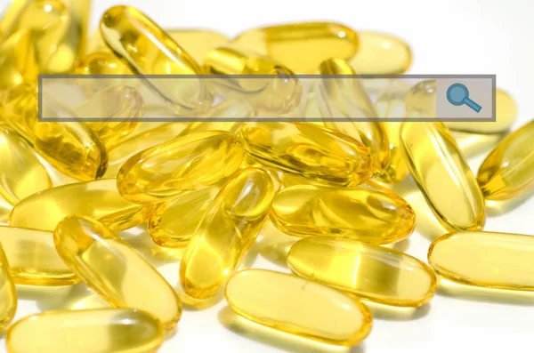 Dietary supplement in soft gelatin capsule in e-medicine concept — Stock Photo, Image