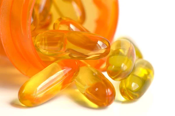 Dietary supplement in soft gelatin capsule. — Stock Photo, Image