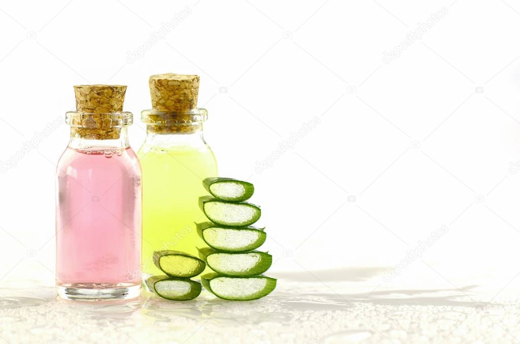 Aloe Vera gel and spa products on white background.