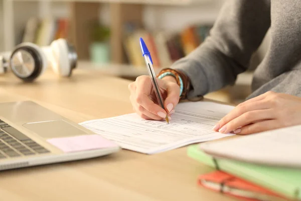 Close Student Girl Hands Fill Out Form Document Sitting Desk — Fotografia de Stock