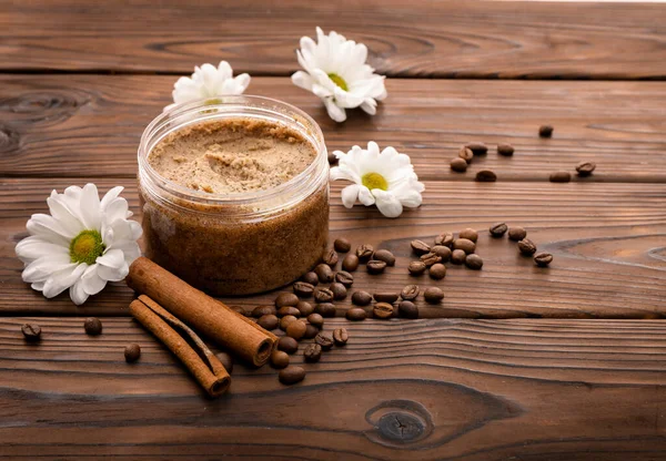 Coffee scrub on brown wooden background