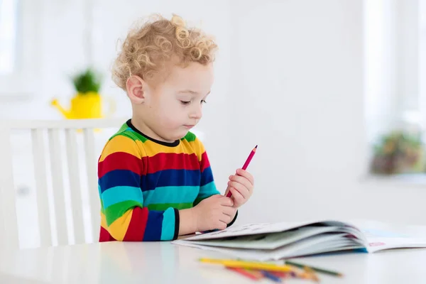 Kids read, write and paint. Child doing homework. — Stock Photo, Image