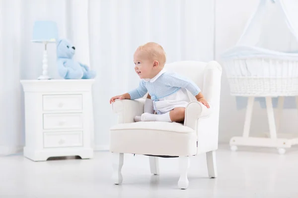 Baby boy playing in bedroom