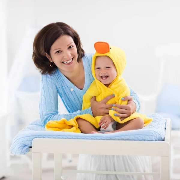 Mother and baby in towel after bath — Stock Photo, Image