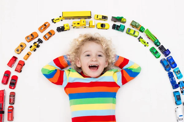 Little boy playing with toy cars. Toys for kids. — Stock Photo, Image