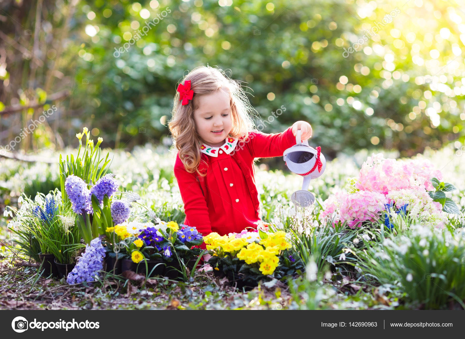 Kids Plant And Water Flowers In Spring Garden Stock Photo Image By C Famveldman Kids Plant And Water Flowers In Spring Garden Stock Photo Image By C Famveldman