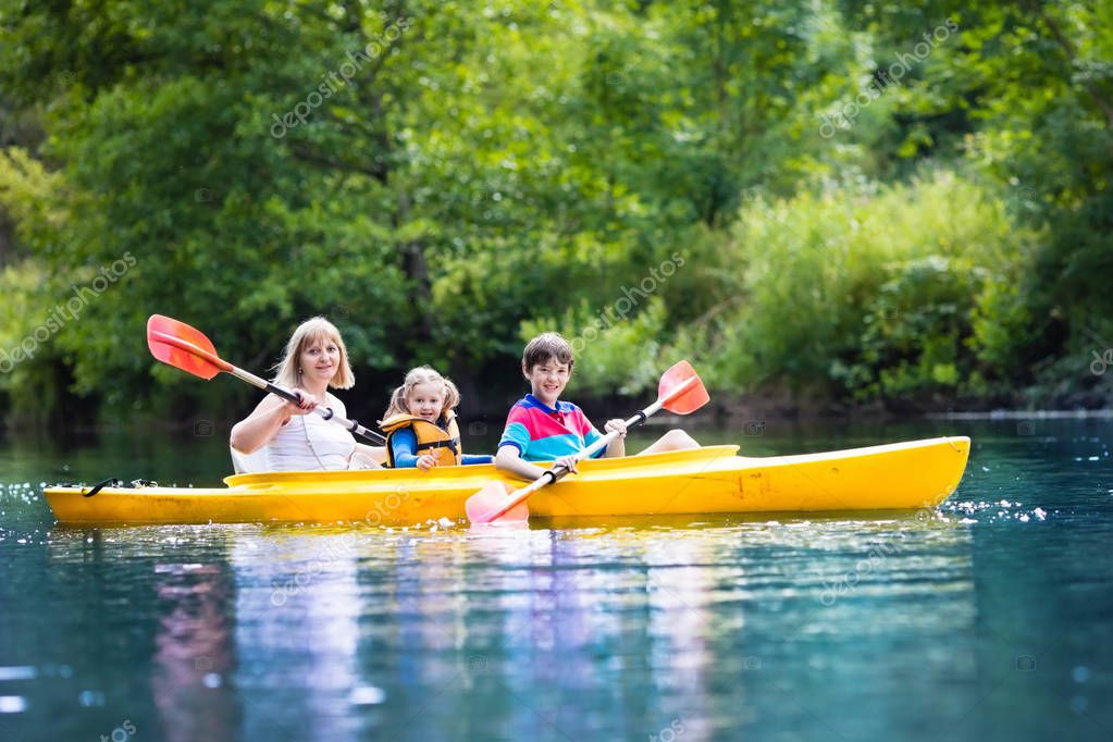 Family enjoying kayak ride on a river — Stock Photo © FamVeldman 143763139