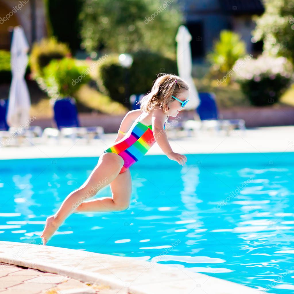 Child in swimming pool on summer vacation