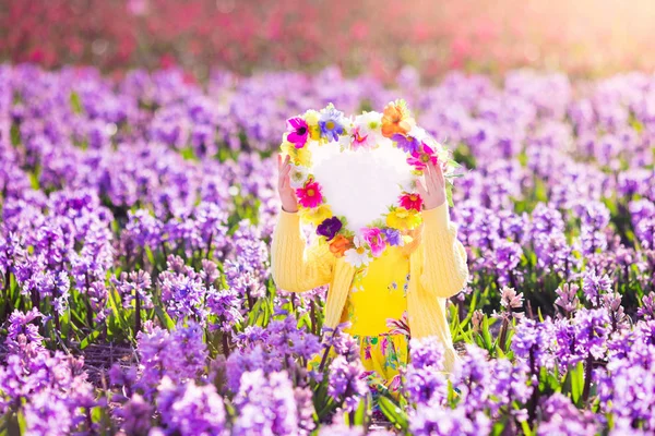 Little girl in hyacinth field — Stock Photo, Image