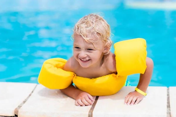 Little boy in swimming pool