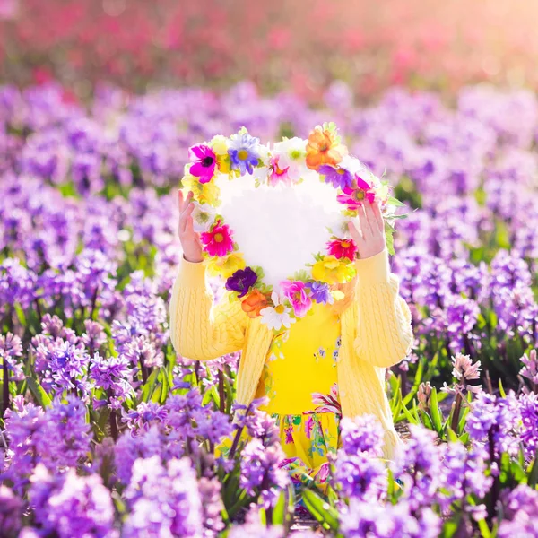 Little girl in hyacinth field — Stock Photo, Image