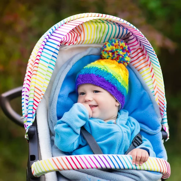 Baby boy in stroller in autumn park — Stock Photo, Image