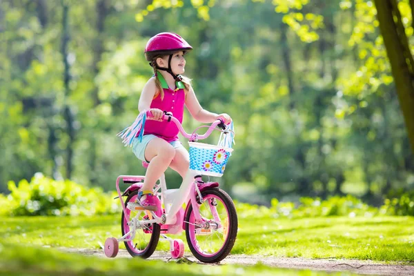 Child riding bike. Kid on bicycle.