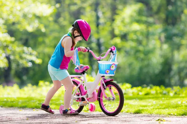 Child riding bike. Kid on bicycle.