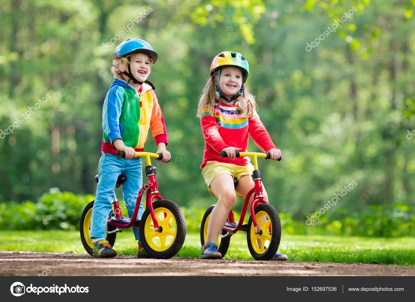 kids riding balance bikes