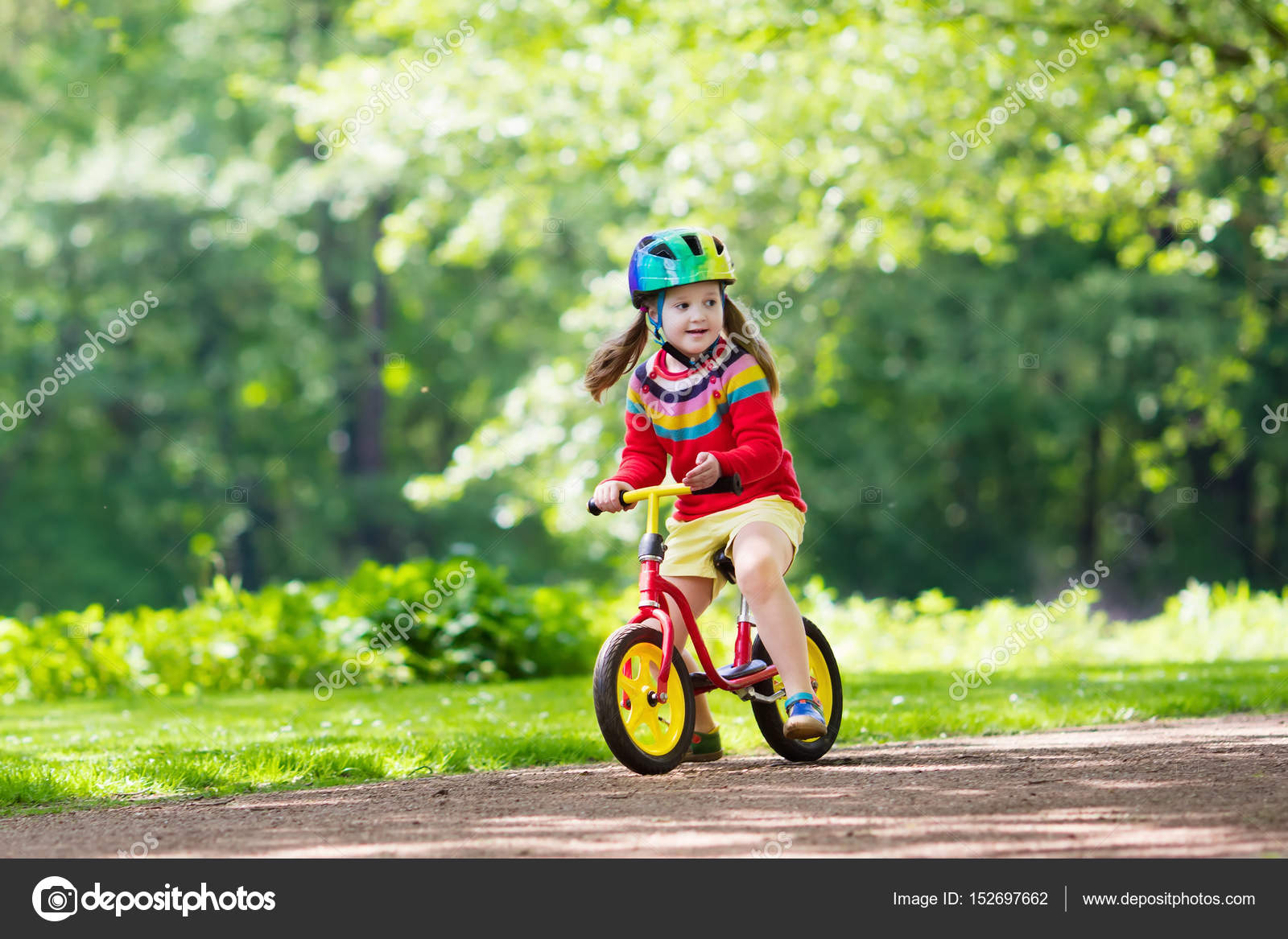 kids riding balance bikes