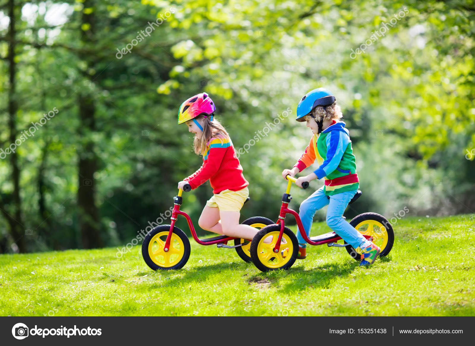 kid riding balance bike