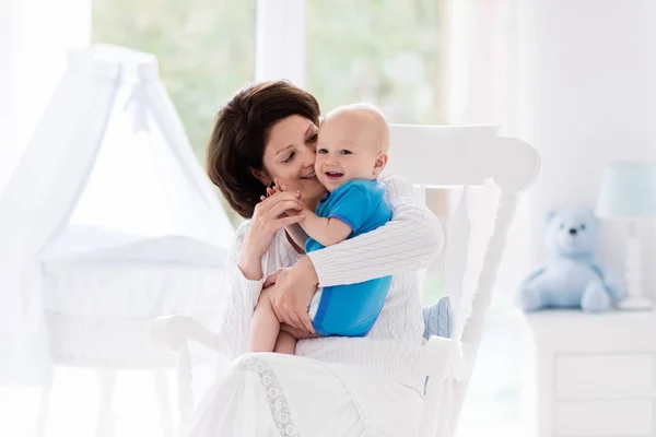 Mother and baby in bedroom