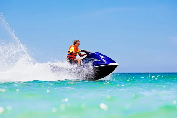 Teenager on water scooter. Teen age boy water skiing. — Stock Photo, Image