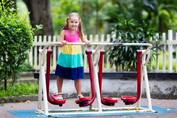 Child on school playground. Kids play.