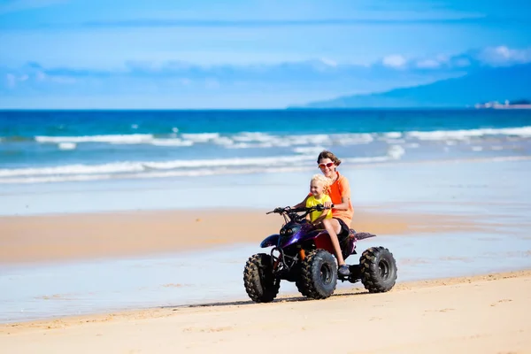 Kids on quad bike. Off road all terrain vehicle. — Stock Photo, Image