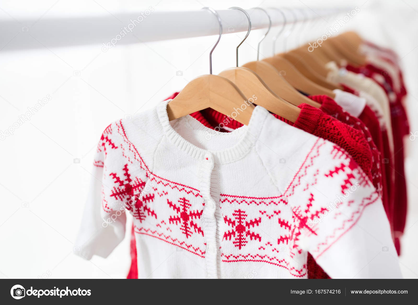 Clothes Rack With Red Christmas Knit Wear Stock Photo