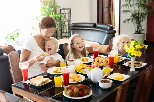 Healthy family breakfast for mother and kids.