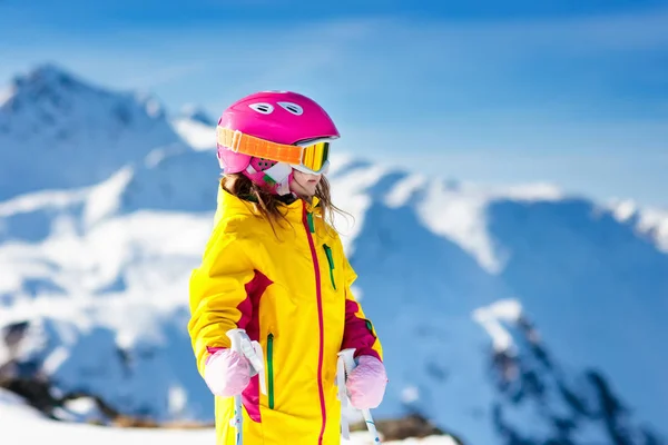 Ski and snow fun. Kids skiing. Child winter sport.