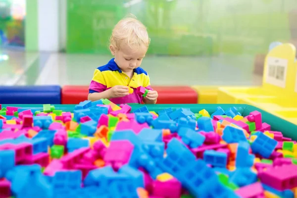 Kids play. Construction toy blocks. Child toys