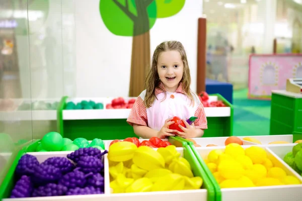 Kids play at toy supermarket or grocery store. — Stock Photo, Image
