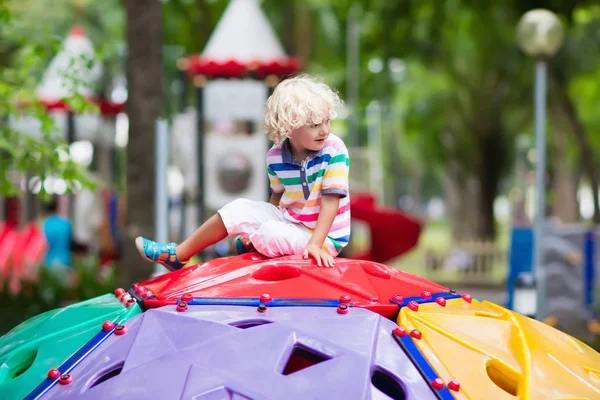 Child on school playground. Kids play.