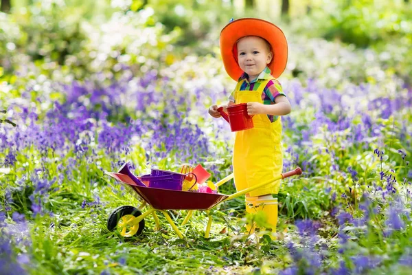 Kids in bluebell garden — Stock Photo, Image