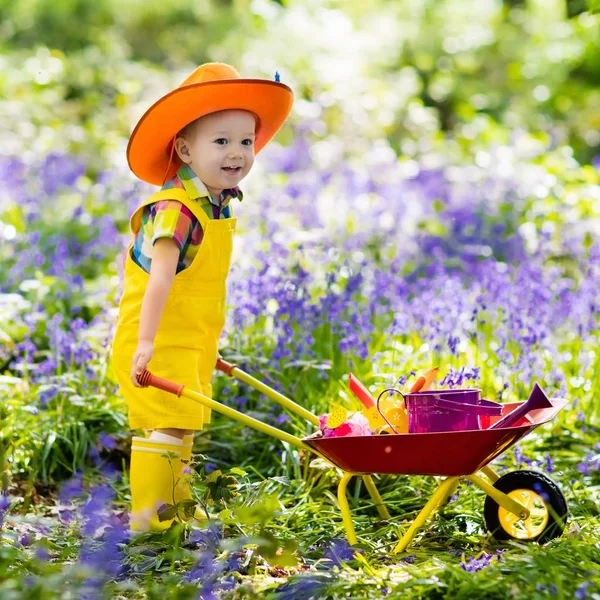 Kids in bluebell garden — Stock Photo, Image