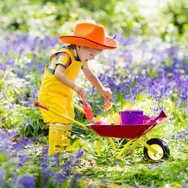 Kids in bluebell garden — Stock Photo, Image