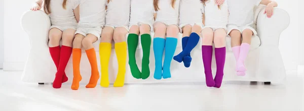 Niños con calcetines de colores. Calzado para niños . —  Fotos de Stock