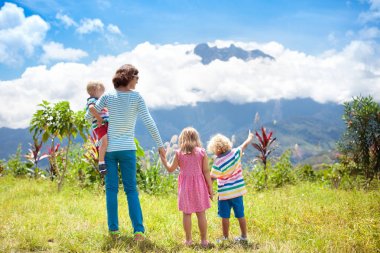 Family hiking in mountains and jungle clipart