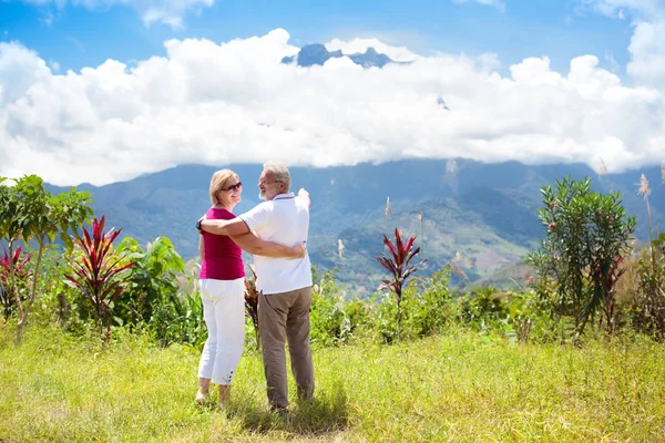 Senior couple hiking in mountains and jungle — Stock Photo, Image