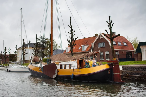 Family on boat in Holland, Amsterdam channels.