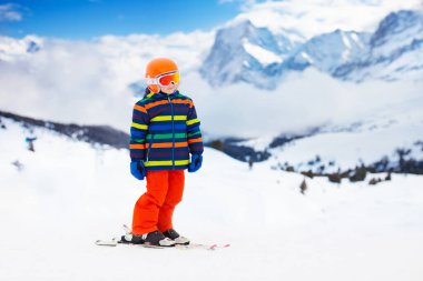 Kids ski. Winter family snow sport. Child skiing