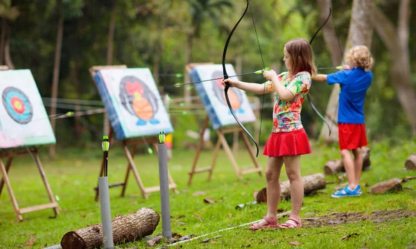 Archery for child. Kids shoot a bow. Arrow, target — Stok fotoğraf