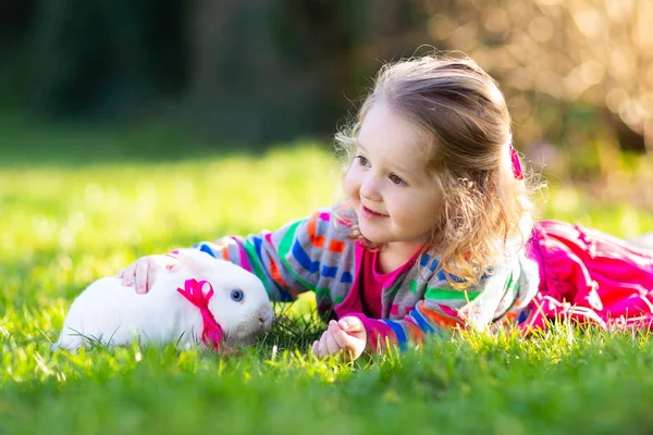 Child with rabbit. Easter bunny. Kids and pets. — Stock Photo, Image