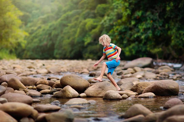 Child hiking in mountains. Kids at river shore. — Stock Photo, Image