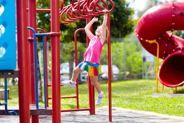 Child on monkey bars. Kid at school playground. — Stockfoto