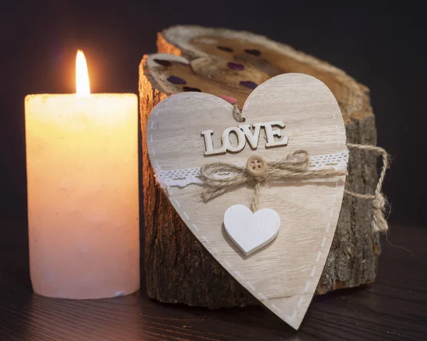 wooden hearts and blackboard a candle valentines day