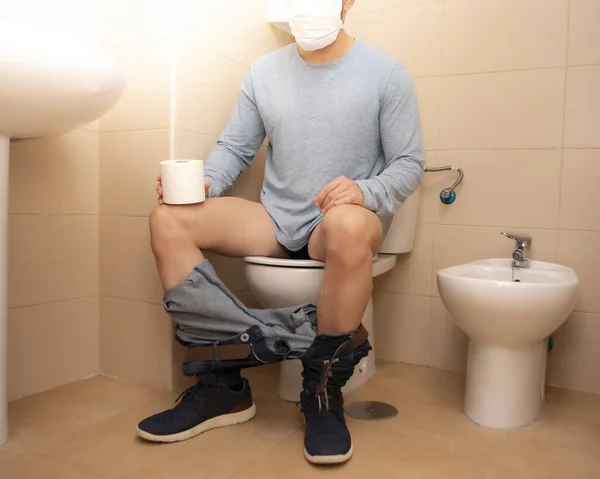Man Sitting Bathroom Mask Toilet Paper Covid — Stock Photo, Image