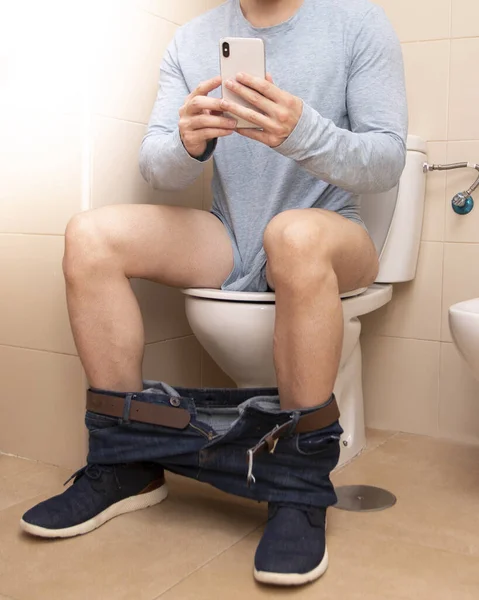 Adult Man Using Smartphone While Sitting Toilet Bowl Home Technology — Stock Photo, Image