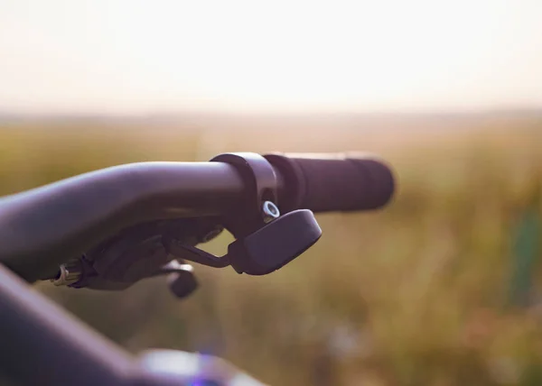 Traveling bike bicycle handlebars at sunset