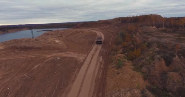 Flight to Drone on Sand Quarry with Heavy Machinery — стоковое видео