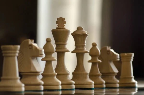 Concept with chess pieces and lighting — Stock Photo, Image